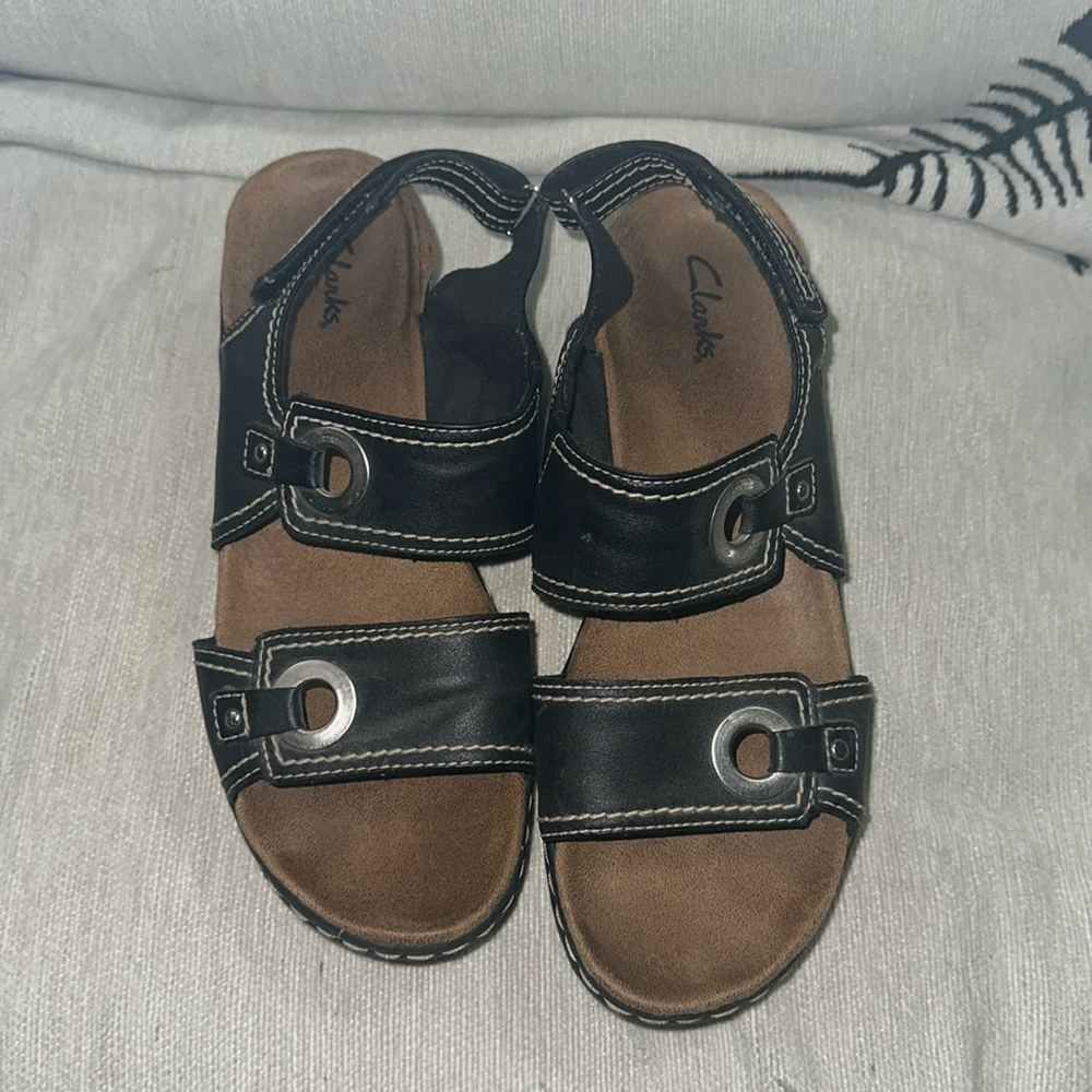 Clark’s size 9M sandals black leather with tan stitching silver hardware